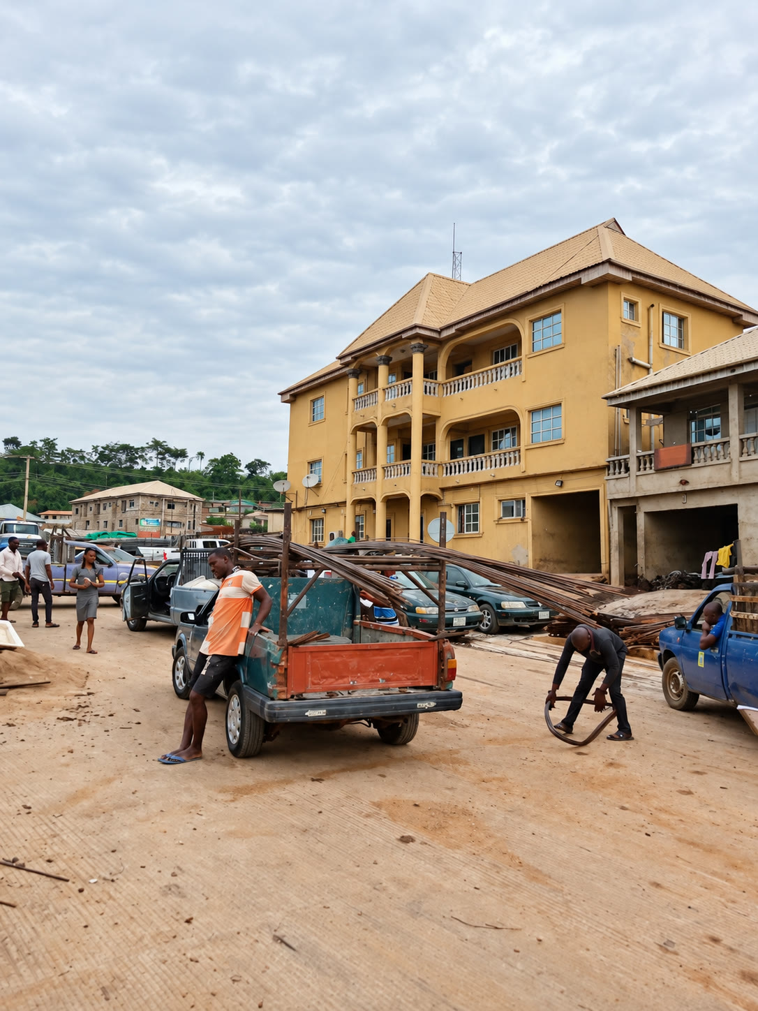 Workers and building materials outside the company building